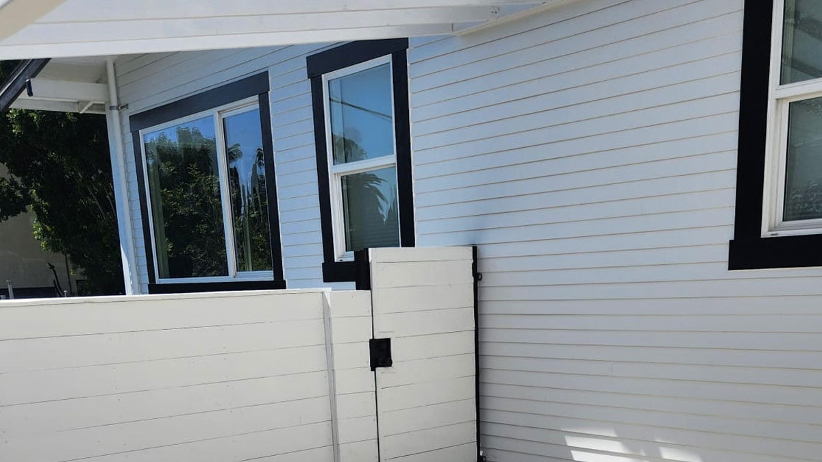 Close-up of fiber cement siding installation with modern trim detailing