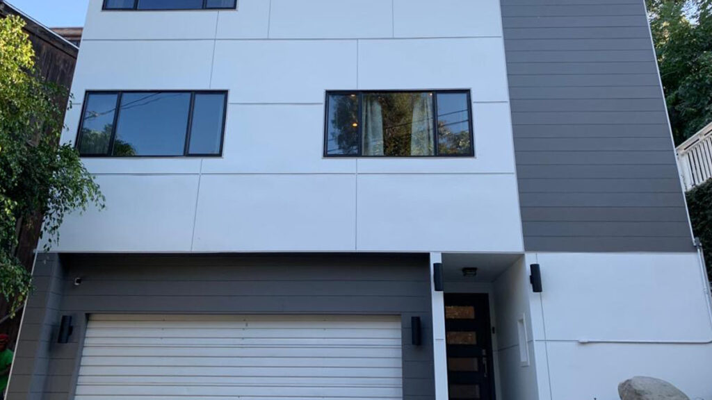 Modern panel siding installed on contemporary residential home