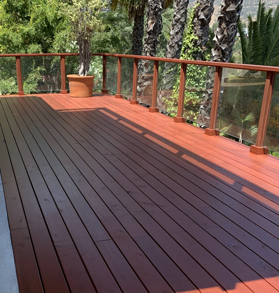 Finished backyard deck with clean wood finish