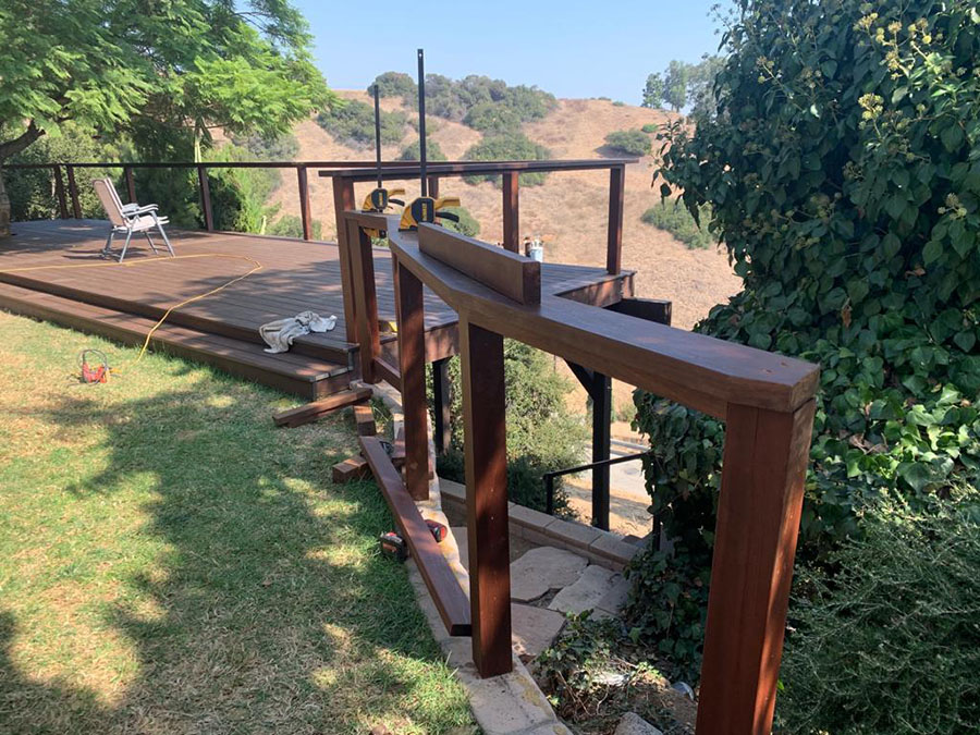 Modern backyard deck project with wood railing system