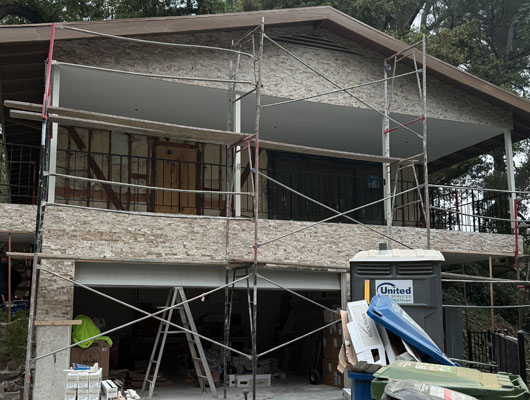 Professional manufactured stone veneer installation on home facade