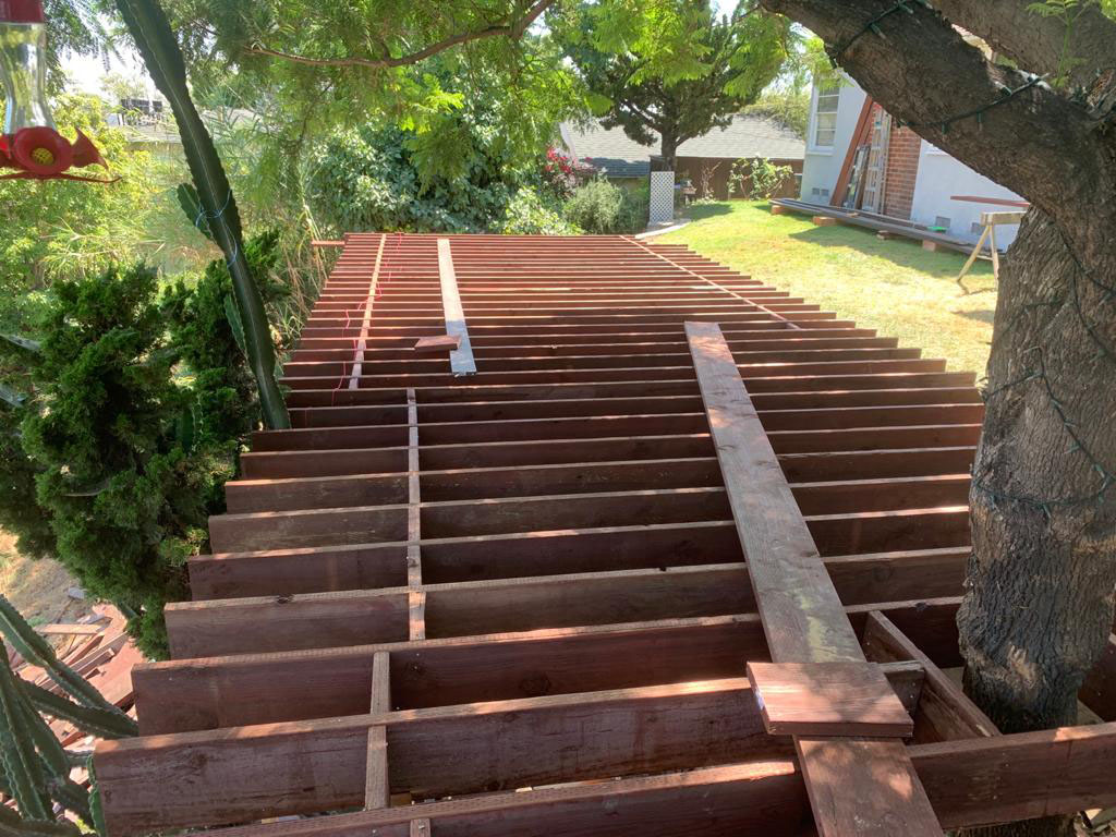 Structural framing installation for elevated hillside deck