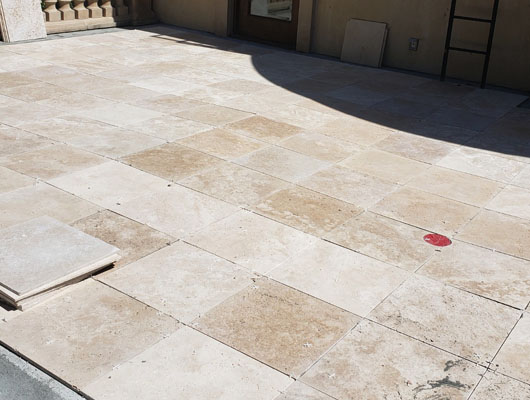 Waterproof deck tile installation Beverly Hills project with exterior drainage correction and natural stone tile finish