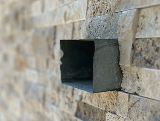 Stone veneer garage facade installation and remodeling