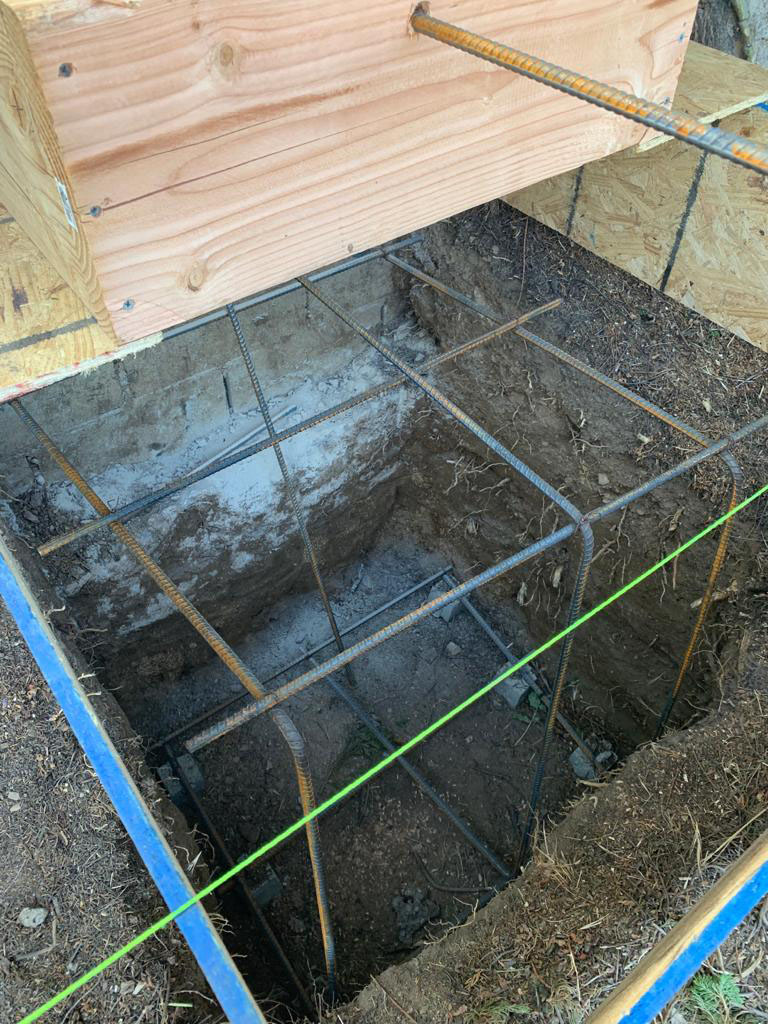 New wood deck construction with modern railing installation