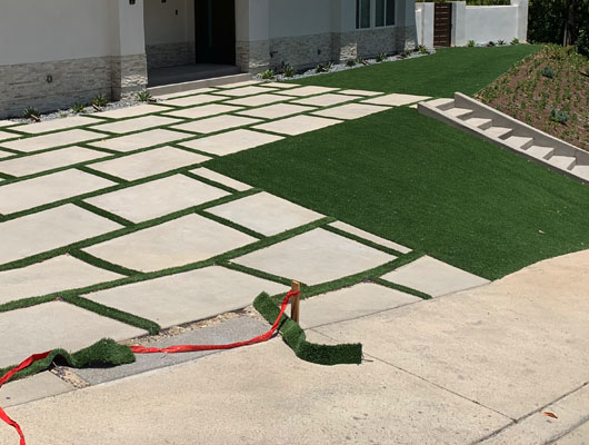 Concrete paver driveway and residential hardscape project completed by JD Renovate with modern architectural styling
