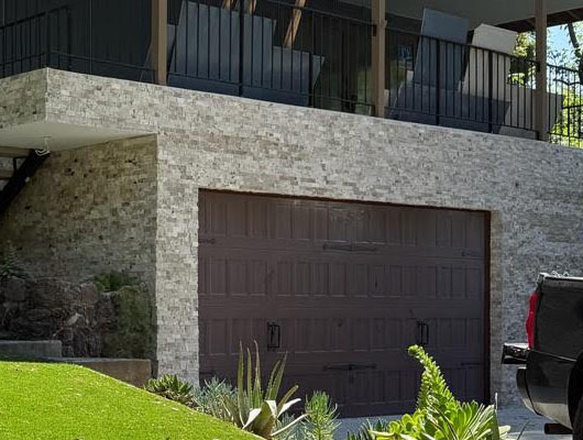 Exterior stone veneer accent wall installation project