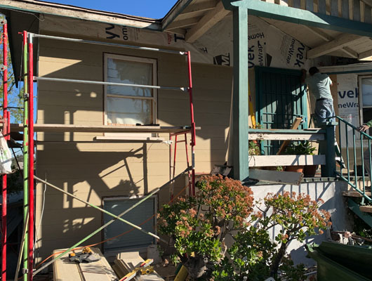 Fiber cement siding installation with trim detailing