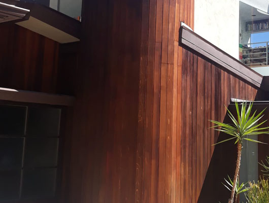 Exterior wood siding renovation with custom trim work and waterproofing preparation on a residential property in Brentwood Los Angeles